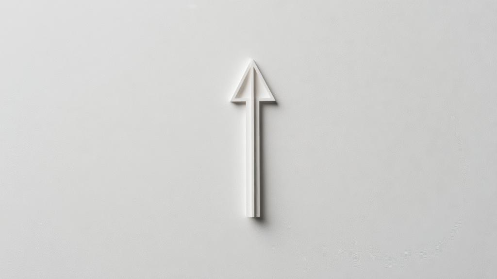 A white arrow pointing upward is centered on a plain, light gray background, symbolizing growth and progress in key business metrics.