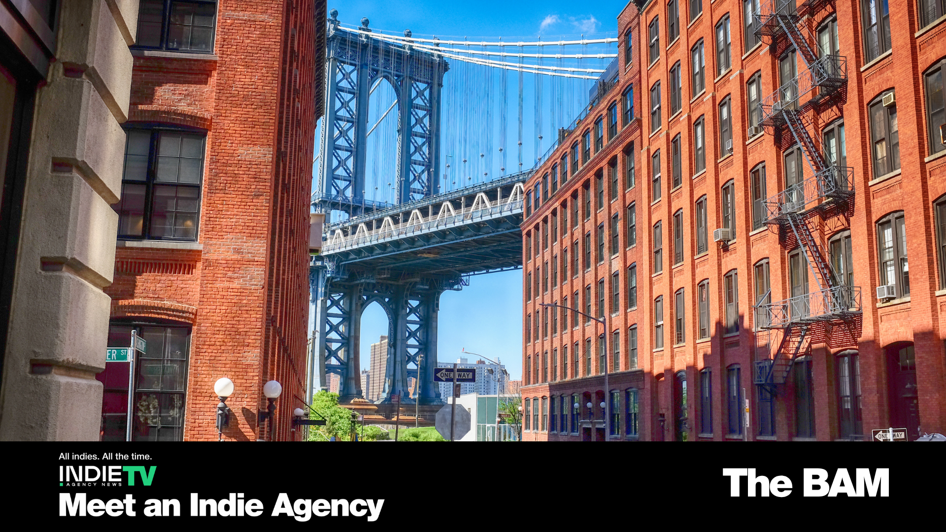 View of the Manhattan Bridge framed by brick buildings in Dumbo, Brooklyn, with blue sky above; event text overlays the bottom of the image, showcasing The BAM Connection’s signature branding.