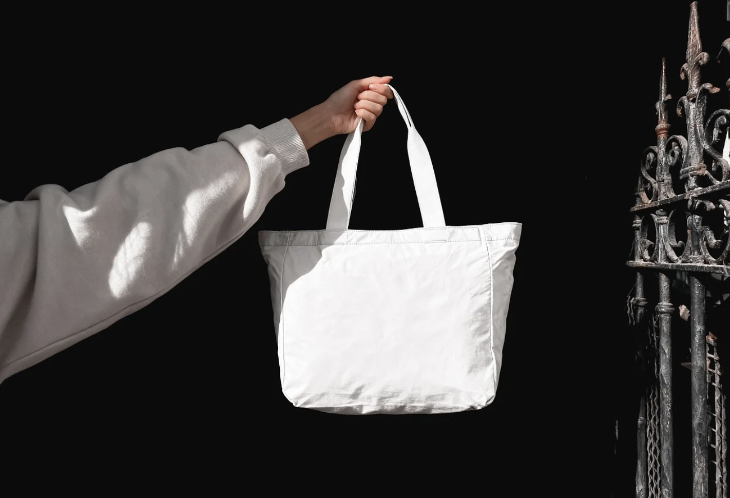 A tote bag is held